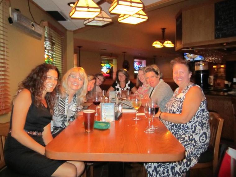 Sitting to the right are authors Nicole Lea Helget and Lorna Landvik.